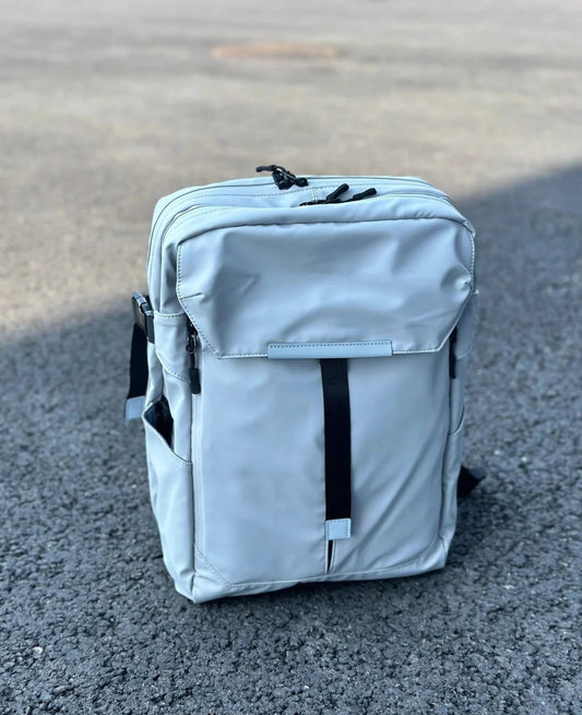 Premium 20L waterproof backpack in light gray featuring clean minimalist design, perfect for modern fathers seeking style and functionality