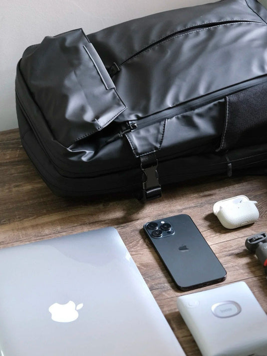 8808 minimalist backpack with clean MacBook, iPhone, and tech accessories in monochrome aesthetic