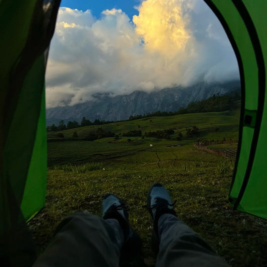 Beautiful mountain landscape view from camping tent during hiking adventure