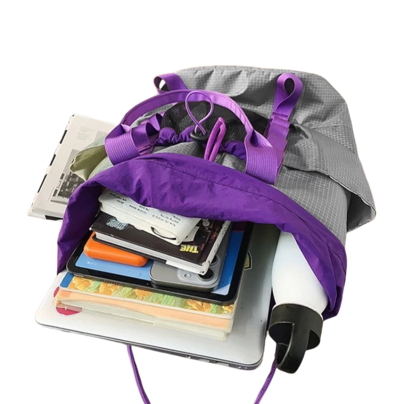 Backpackbeat 7713 Lightweight Backpack 22L open showing laptop compartment, books, and internal organization with purple straps and gray fabric