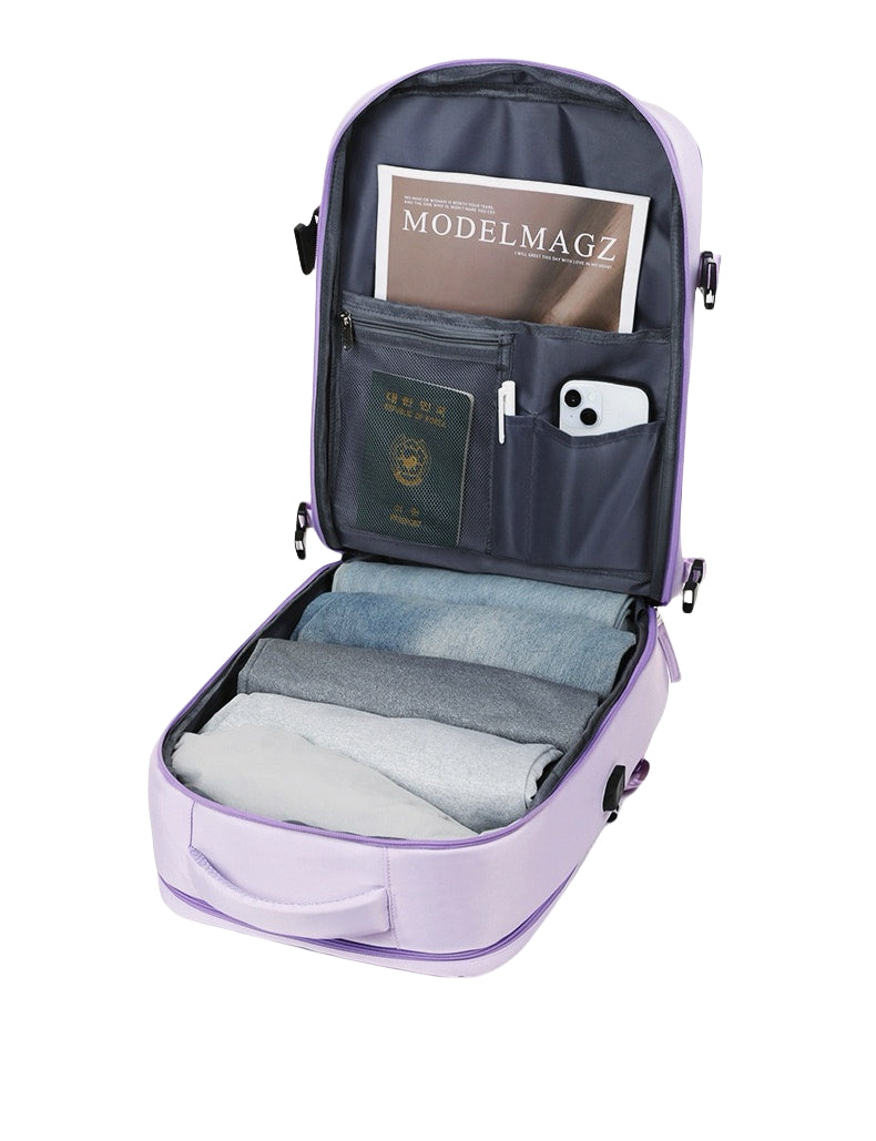 Purple 8802 travel backpack 35L fully opened showing organized interior compartments with magazine, passport, phone, and folded clothes demonstrating efficient packing system