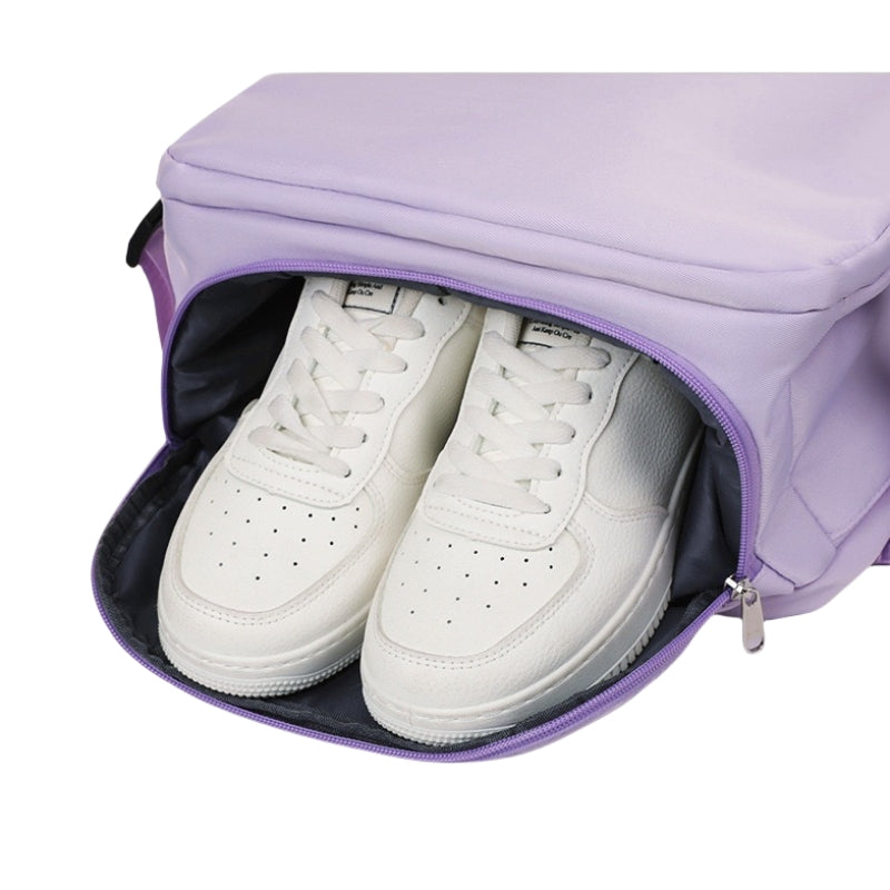 Purple 8802 travel backpack 35L bottom compartment opened displaying white sneakers stored separately, featuring dedicated shoe storage with ventilation mesh