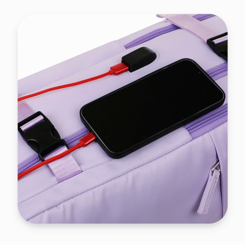 Purple 8802 travel backpack 35L external USB charging port with smartphone connected via red cable, showing built-in power bank compatibility for device charging