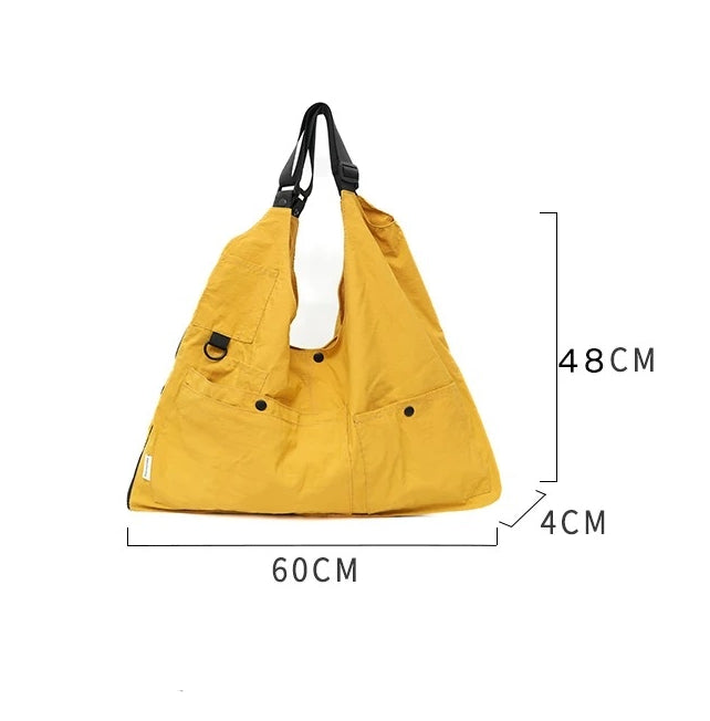 A yellow 9902 Wearable Crossbody Bag shown with its dimensions clearly marked: 60 cm width, 48 cm height, and 4 cm depth, indicating its size.