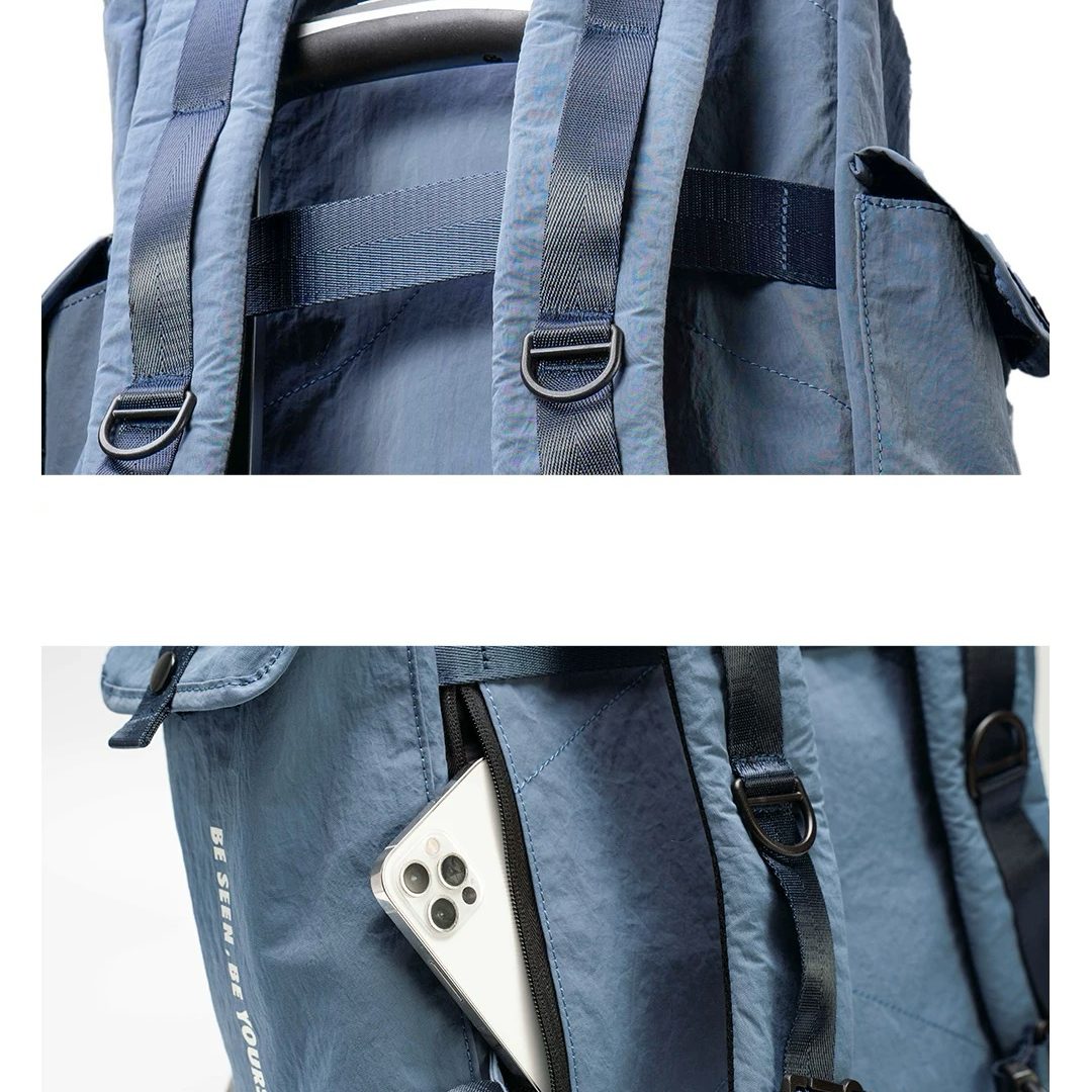 Close-up of waterproof backpack shoulder strap system and luggage trolley attachment for travel convenience