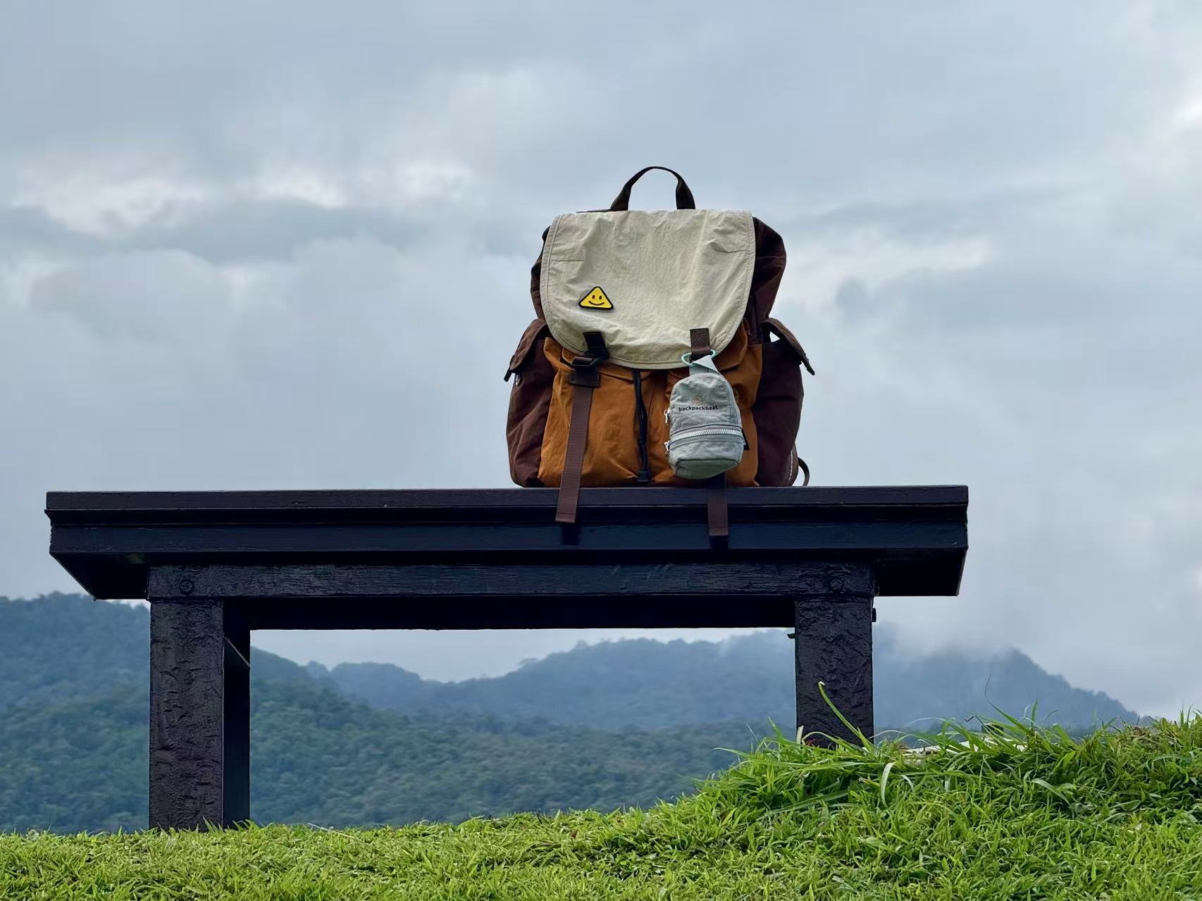 Stylish college backpack on a bench with mountain view, ideal for campus and everyday travel