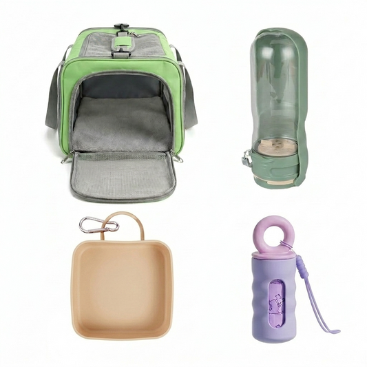 The pet travel gear set flat lay showing green soft sided pet carrier open with fleece mat, sage green dog water bottle, warm beige collapsible dog bowl with carabiner, and lavender poop bag dispenser on white background