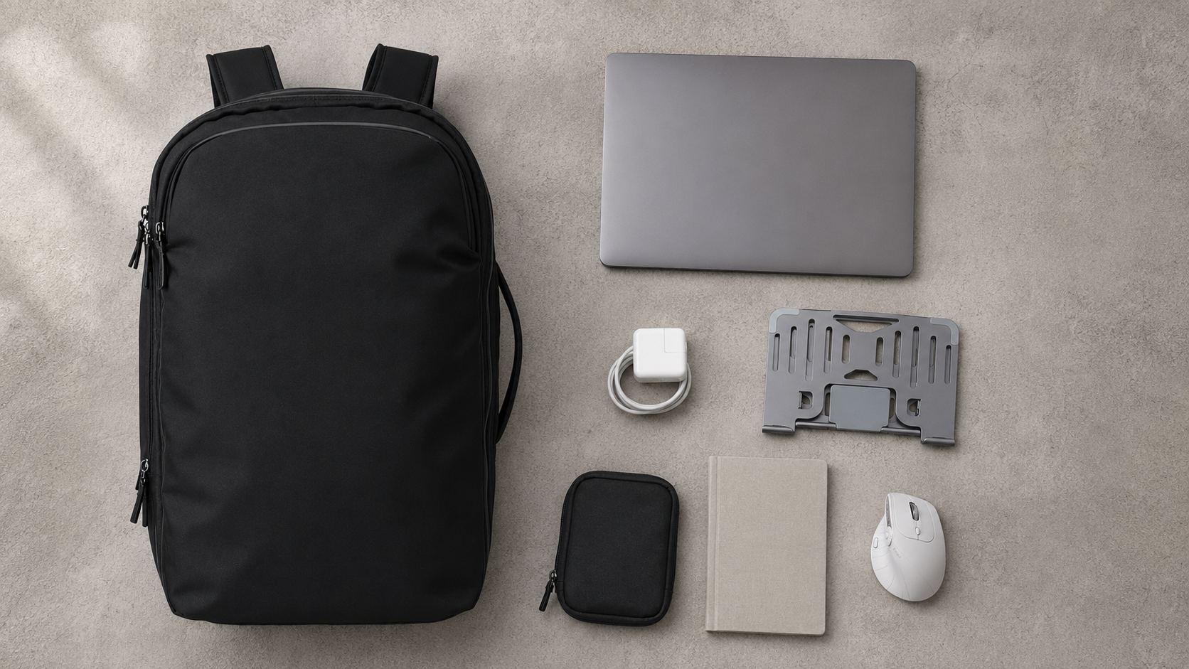 BackpackBeat 8807 backpack arranged with a laptop, foldable stand, vertical mouse, charger, cable pouch and notebook