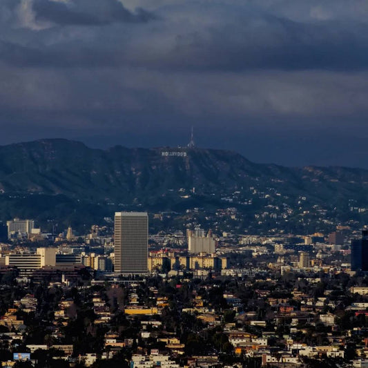 Los Angeles cityscape with Hollywood sign visible on hills and downtown buildings showing classic LA views from Echo Park vicinity