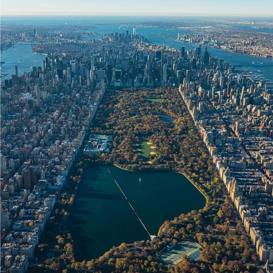 Aerial view of Central Park surrounded by Manhattan skyscrapers in autumn - seven years in same city proving yourself in corporate career before digital nomad escape