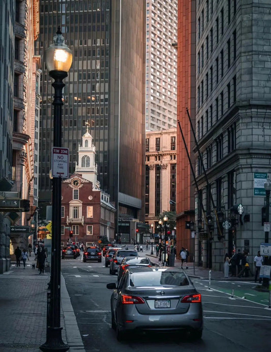 Evening view of Boston’s Financial District with streetlights and historic buildings