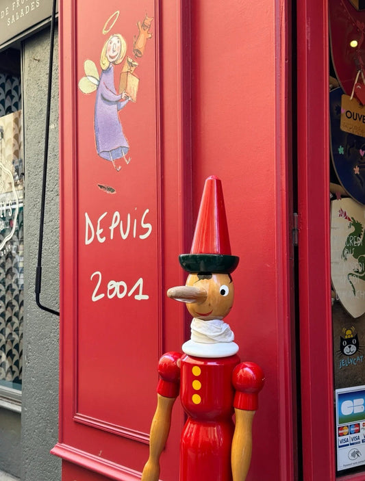 Entrance of Paul Bocuse Food Market with red signage in Lyon