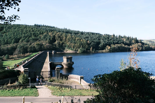 Misty view of Ladybower Reservoir surrounded by forest in the Peak District