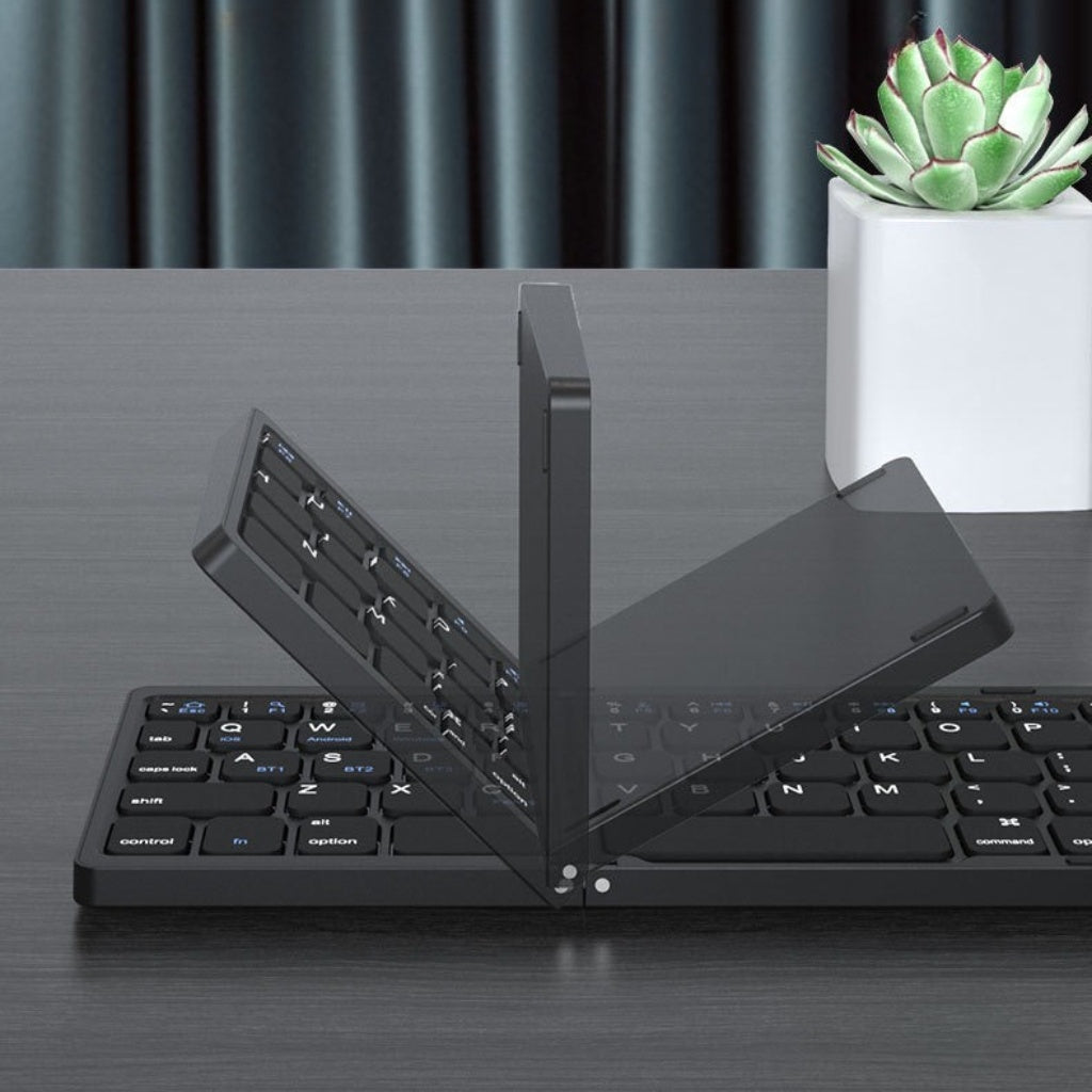 Backpackbeat 1113 foldable Bluetooth keyboard shown at various fold angles on desk with succulent plant