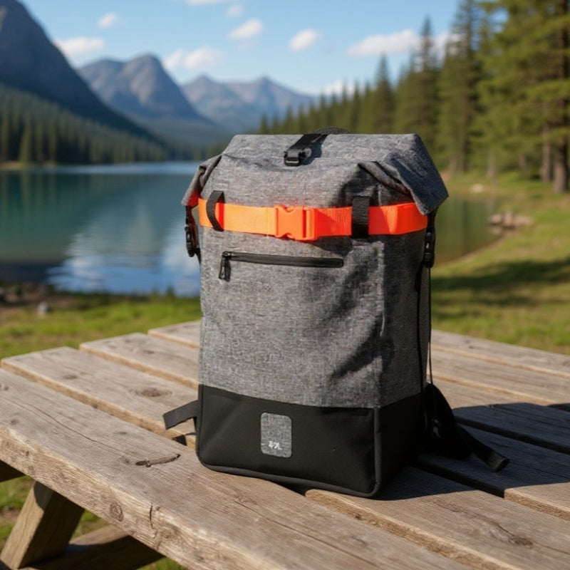 6600 Completely Waterproof Backpack 40L placed on a wooden bench by a mountain lake, ideal for hiking and camping trips