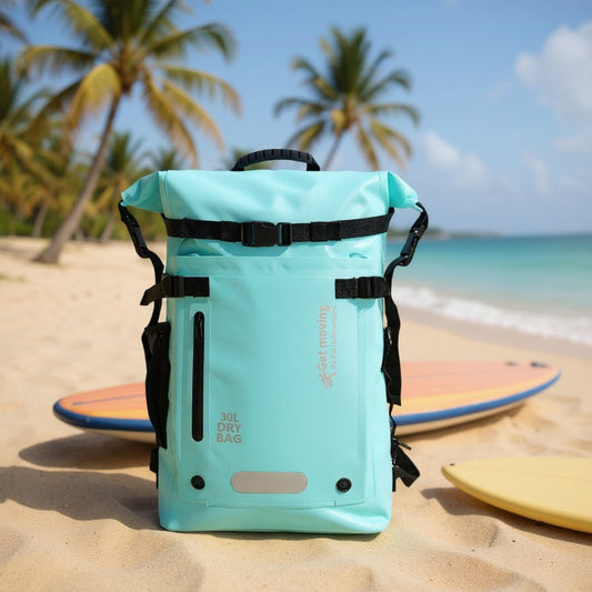 6603 waterproof backpack for travel 30L on tropical beach with surfboard, demonstrating water-resistant protection for beach and water sports activities