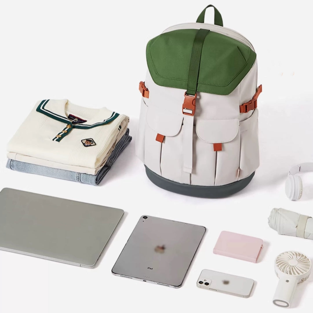 7708 stylish waterproof backpack 28L shown with daily items including laptop, tablet, clothes and accessories demonstrating ample storage capacity