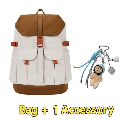 Cream and brown 7708 stylish waterproof backpack 28L featuring vintage-inspired design, dual front pockets, buckle closure system, orange accents and one charming accessory with bear keychain and carabiners