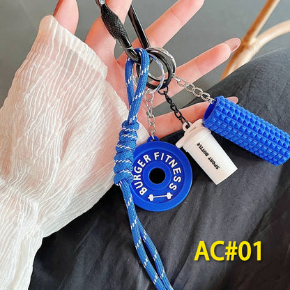 Blue fitness gear keychain set AC#01 featuring BURGER FITNESS weight plate charm, textured foam roller, and braided lanyard - premium workout accessories for gym enthusiasts