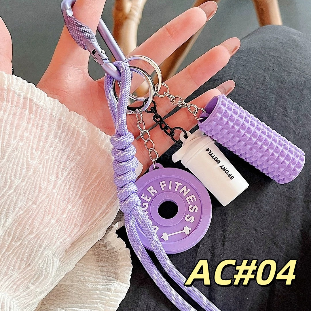 Purple fitness keychain AC#04 with BURGER FITNESS weight plate, foam roller, and Sport Bottle tag attached via chains and carabiner