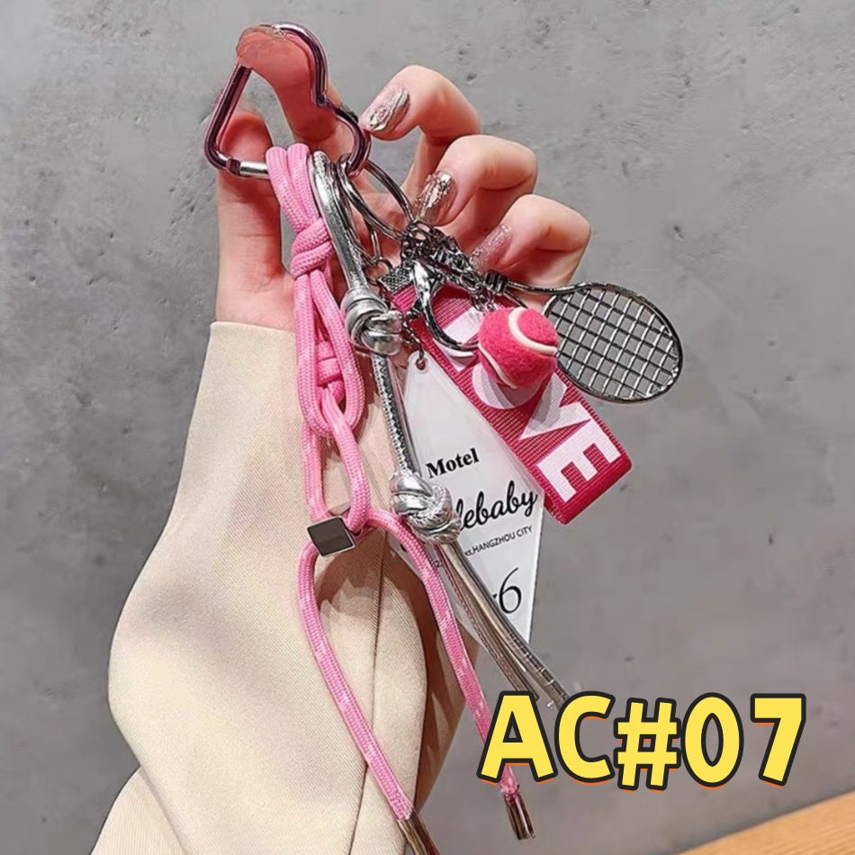Pink fitness keychain AC#07 featuring tennis racket charm, motel room card tag, Sport Bottle attachment with braided pink cord and carabiner