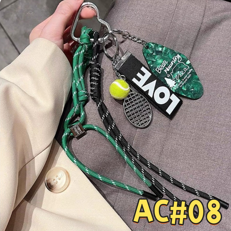Green and black tennis-themed keychain AC#08 with LOVE tag, tennis ball, racket charm, and dual-color braided cord with carabiner clip