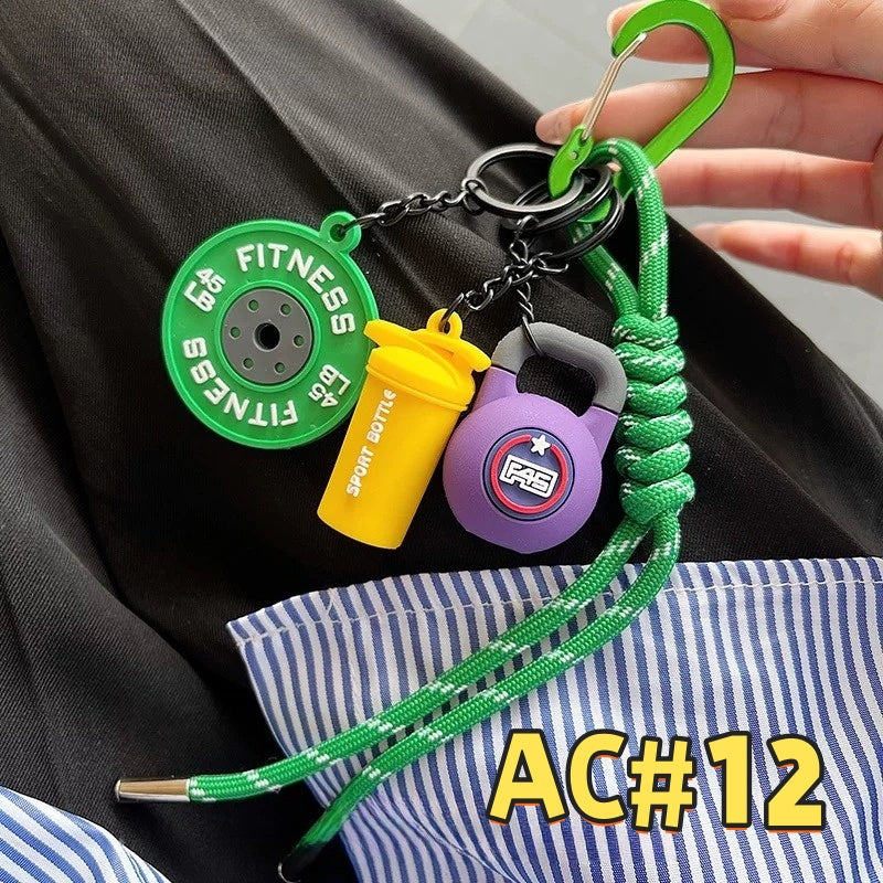 Green fitness keychain AC#12 with FITNESS weight plate, 200kg purple kettlebell, yellow Sport Bottle tag and braided green cord with carabiner