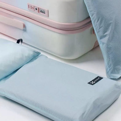 BackpackBeat waterproof wet dry bag laid flat beside suitcase highlighting ultralight and packable material