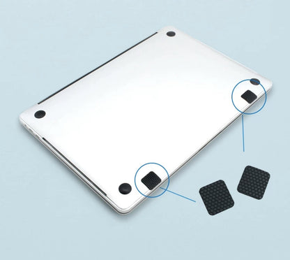 BackpackBeat 1103 anti-slip honeycomb pads shown attaching to bottom corners of silver laptop
