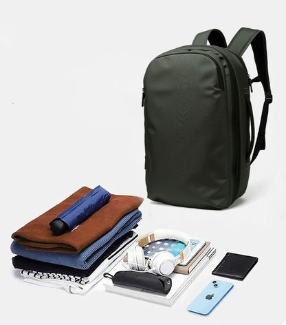 BackpackBeat 8807 army green backpack shown with full packing contents clothes headphones phone wallet