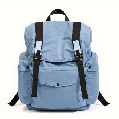 A front-facing view of the light blue Backpackbeat 7712 Lightweight Backpack 25L, isolated on a clean white background. The backpack features a modern, streamlined design with black straps and light blue accents. This image showcases the product's details and sleek aesthetics.