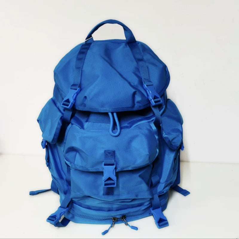 Blue lightweight hiking backpack with water-repellent fabric and comprehensive compartment system