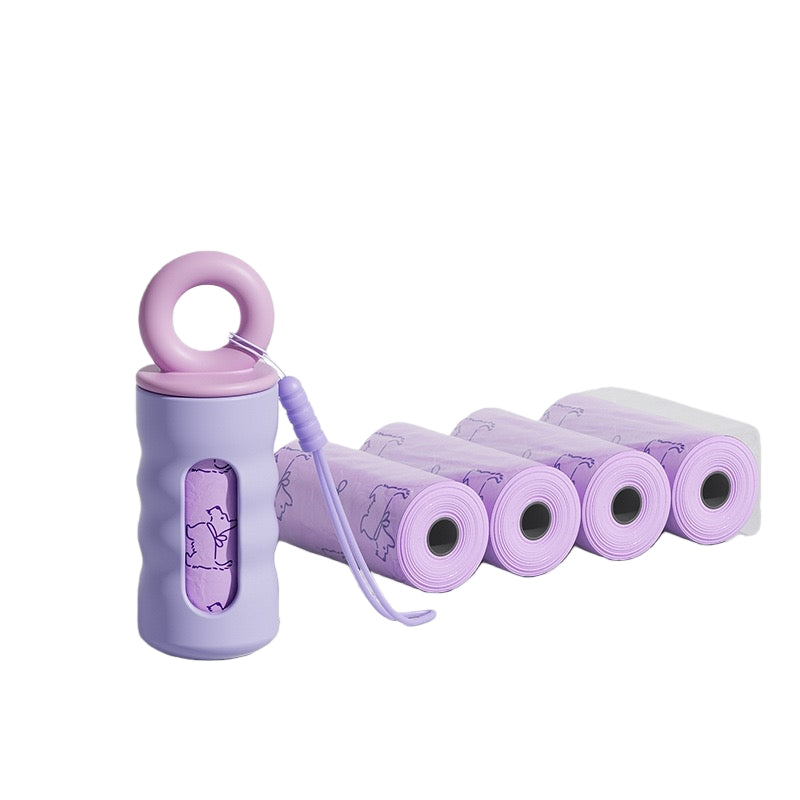 P803 lavender purple silicone poop bag dispenser with pink ring loop shown with 4 refill rolls of purple dog waste bags, white background