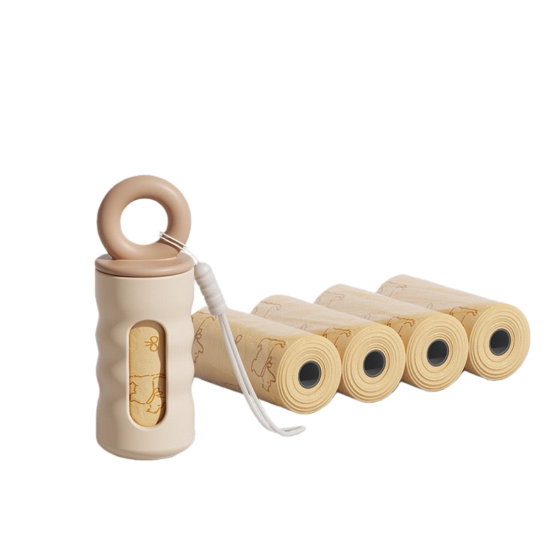 P803 warm beige silicone poop bag dispenser with matching ring loop shown with 4 refill rolls of natural kraft dog waste bags, white background