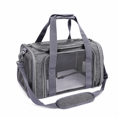 Angled view of the grey P8113 pet carrier showing its mesh top, side ventilation and shoulder strap