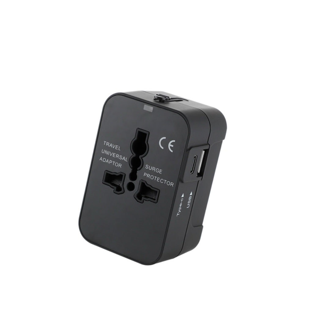 Black universal travel adapter with surge protector, Type-C and USB ports, compatible with 183 countries — essential digital nomad power accessory